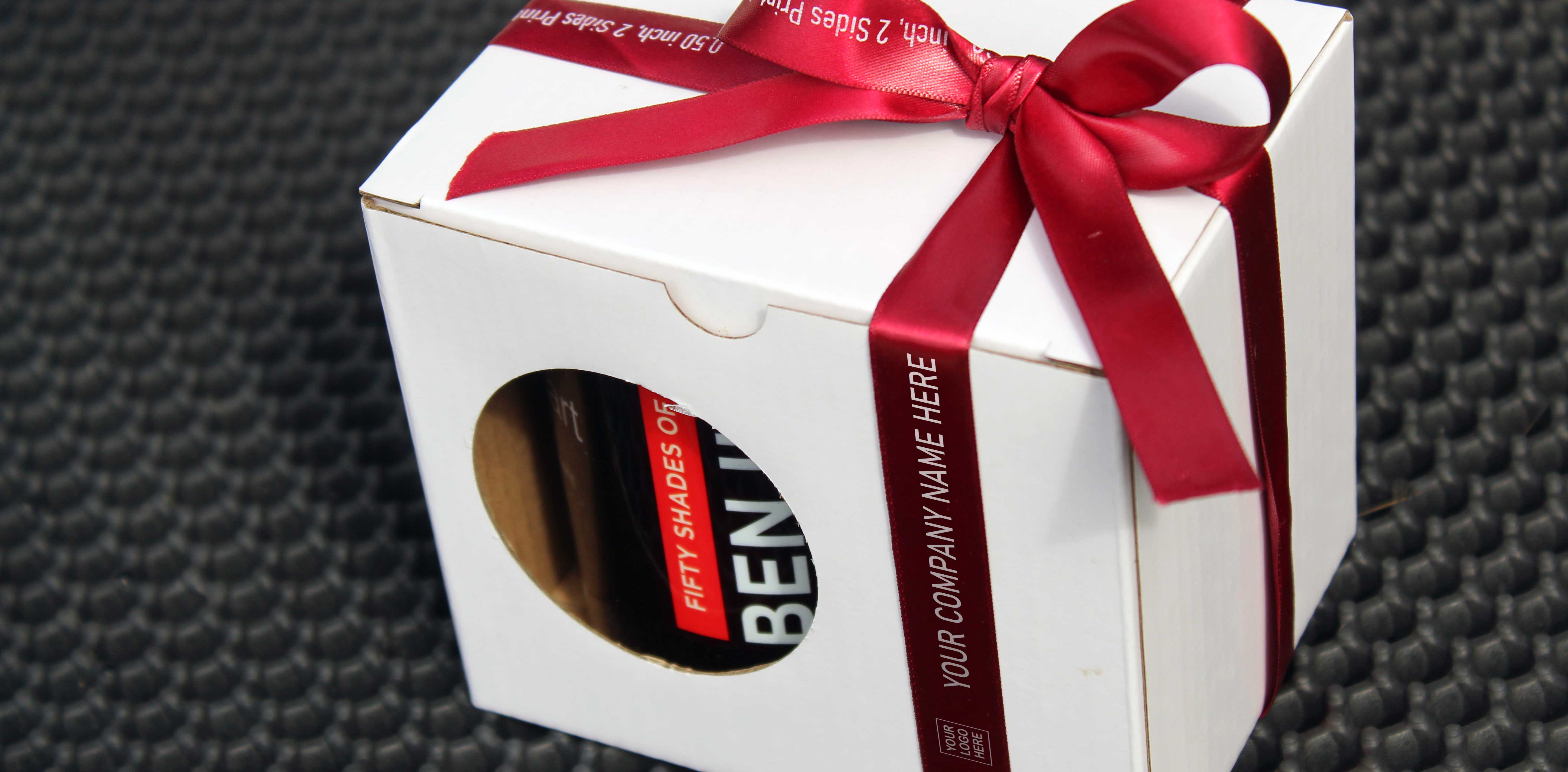 custom printed coffee mug with printed ribbon as corporate giveaway