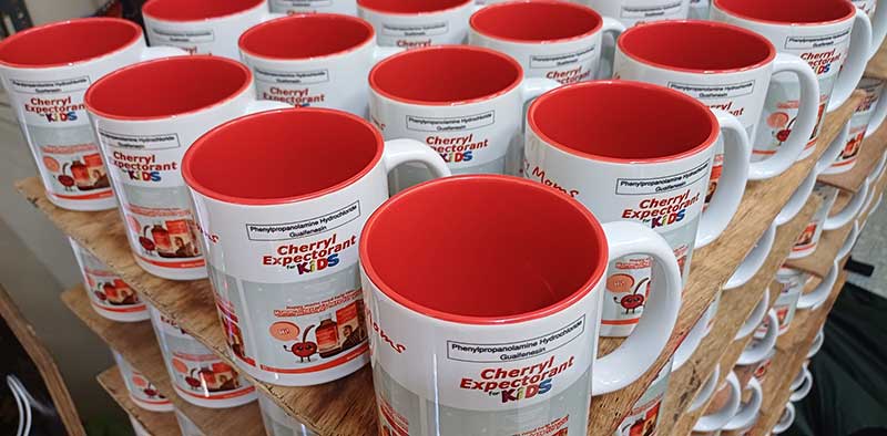 Sublimation printing on ceramic coffee mugs as corporate giveaways